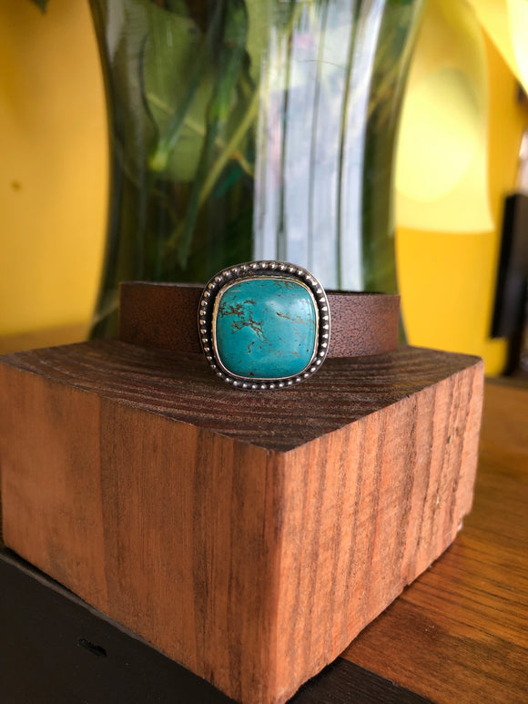 Turquoise with bead trim on brown leather